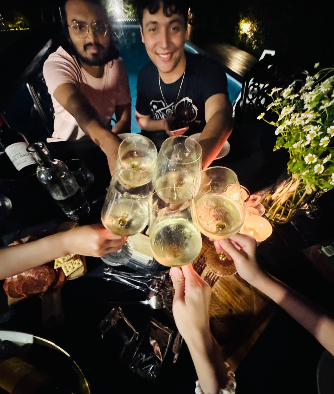 Wine glasses raised in a toast